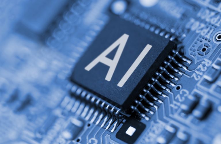 Close Up of Computer Chip with AI Text