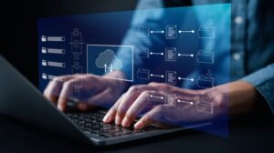 Person Working on a Laptop with File Folder Graphics