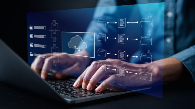 Person Working on a Laptop with File Folder Graphics