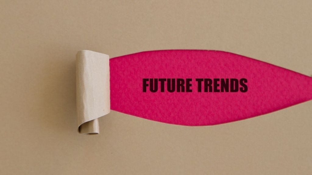 Future Trends Text on Pink Background Beneath Tan Cover Sheet