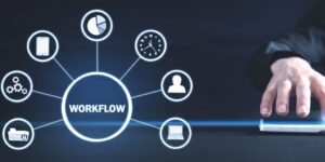 Hand on Tablet with Workflow Diagram