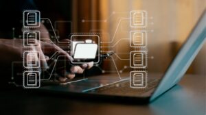 Document Management Graphics Over Man Working on Laptop