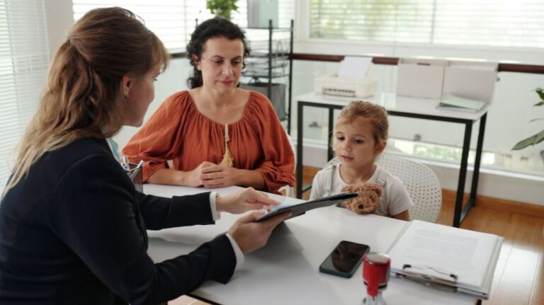 Social Worker Talking to Mother and Daughter