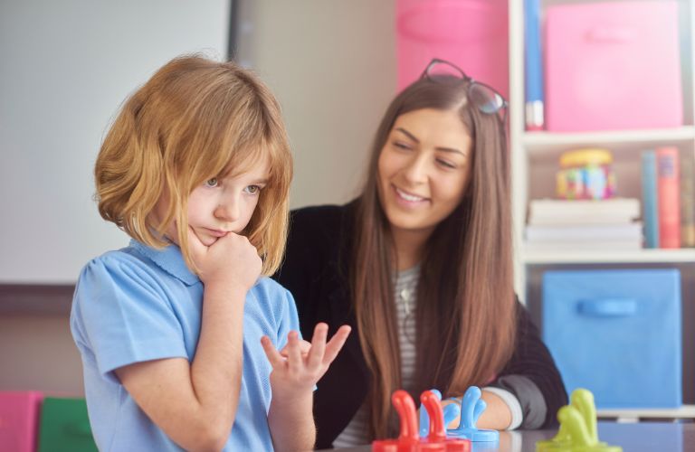 Woman at a Table with Young Girl